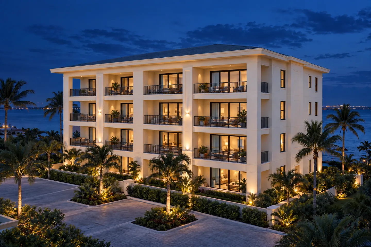 Illustrative condominium with straight balconies and a shallow pitched roof at blue hour